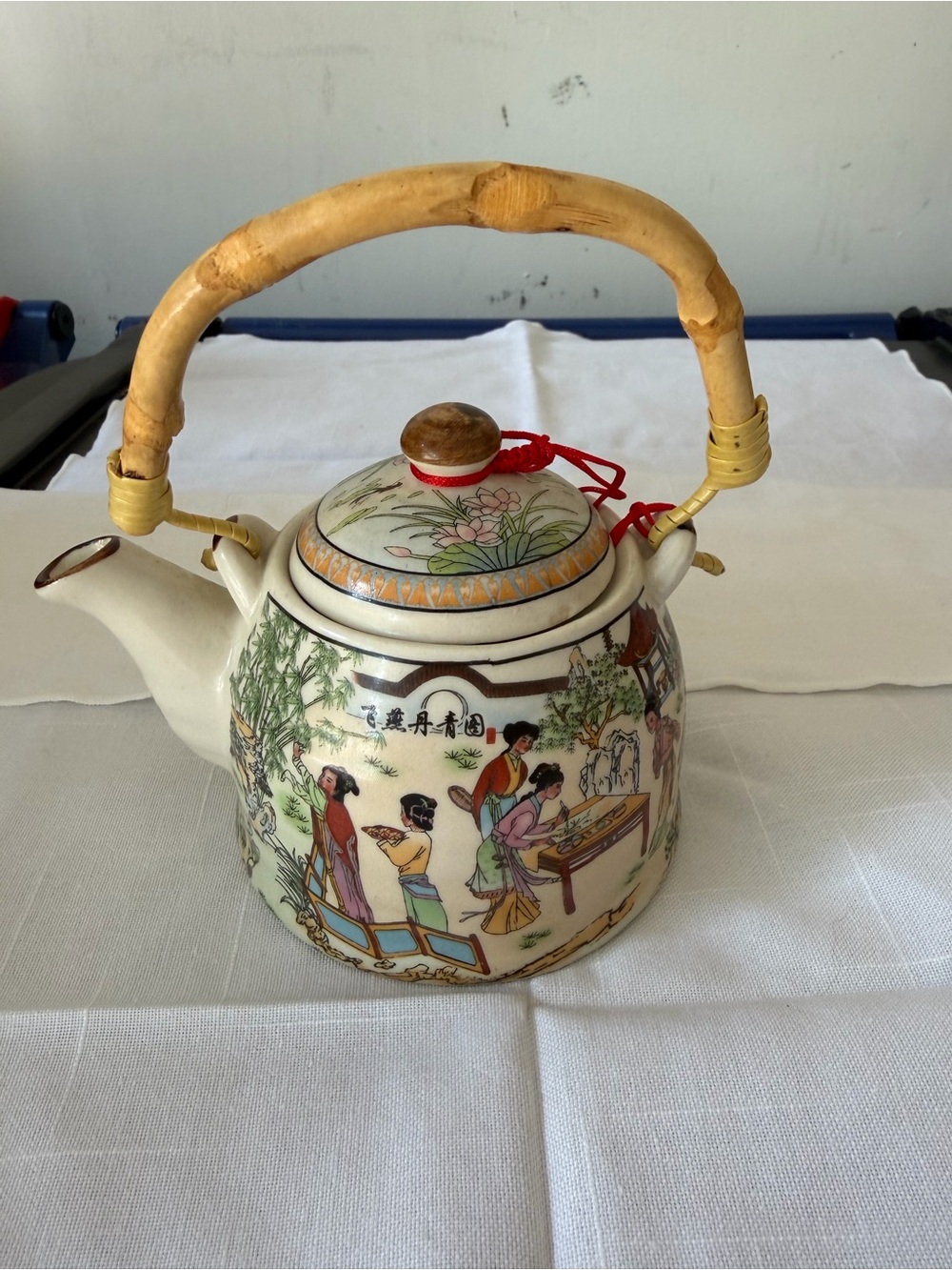 Traditional Hand-Painted Ceramic Teapot with Bamboo Handle - White